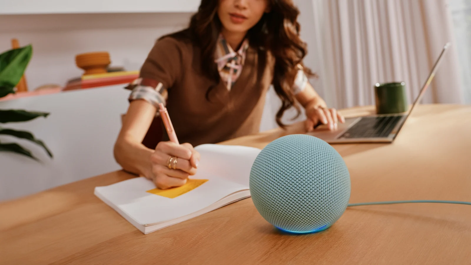 Green Echo Dot on a desk